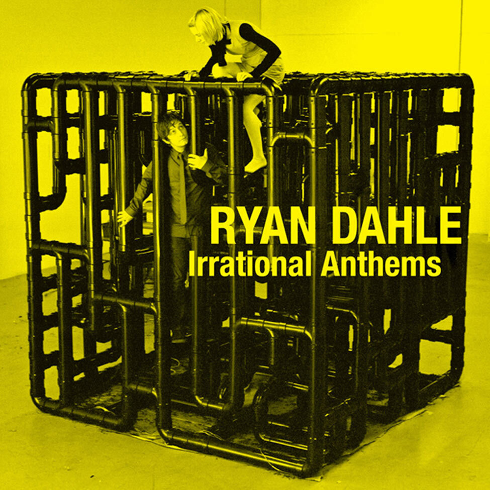 Album Cover Title Irrational Anthems Artist Ryan Dahle with female band member playing on giant PVC toy structure black and white toned bright yellow