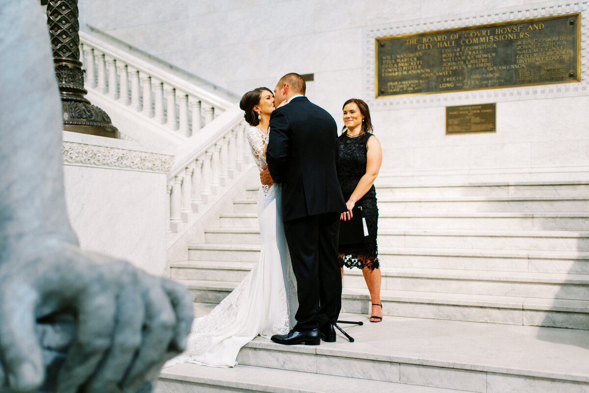 bride and groom kissing at the Ceremony at Minneapolis City Hall