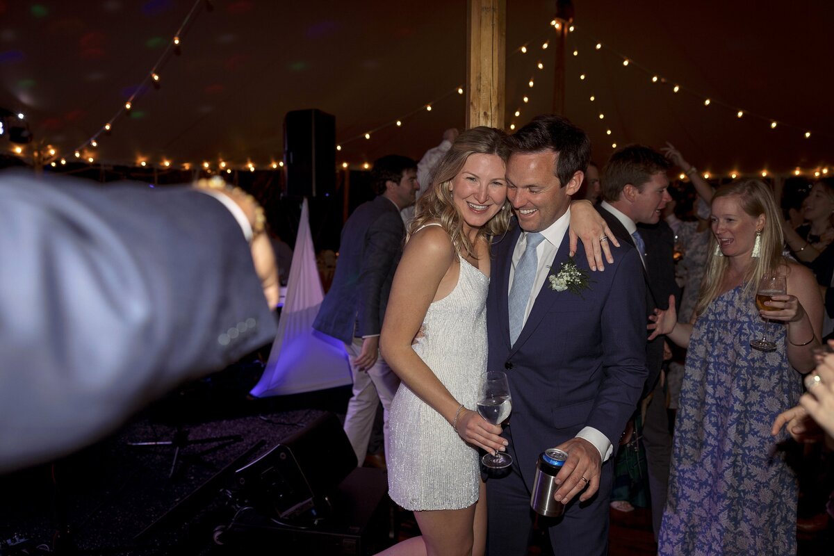 Bride and Groom embrace as they dance during their Nantucket wedding reception.