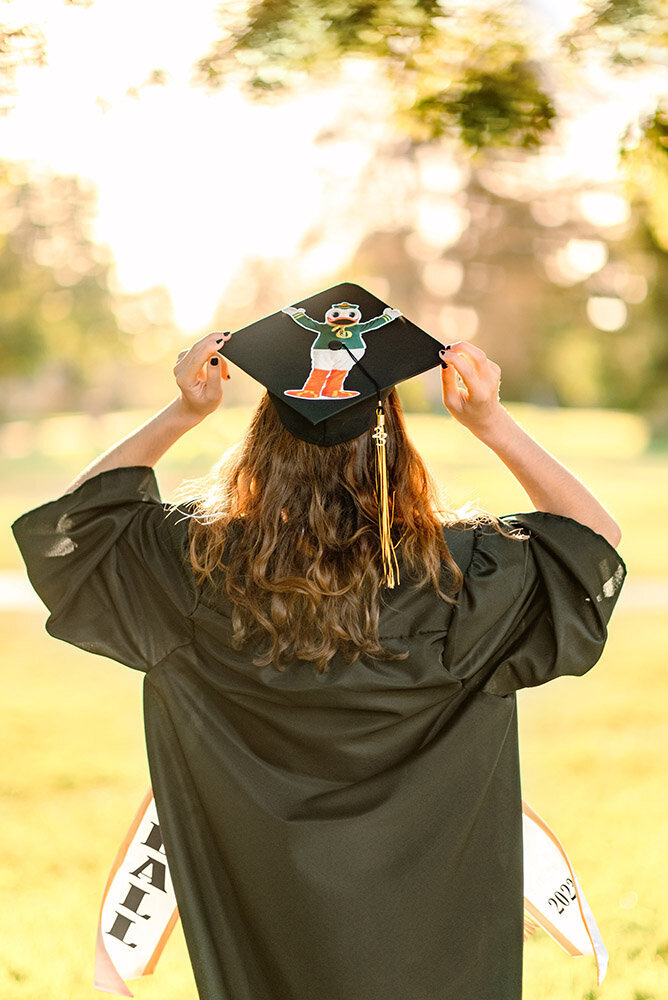 High School graduate holding her decorated cap