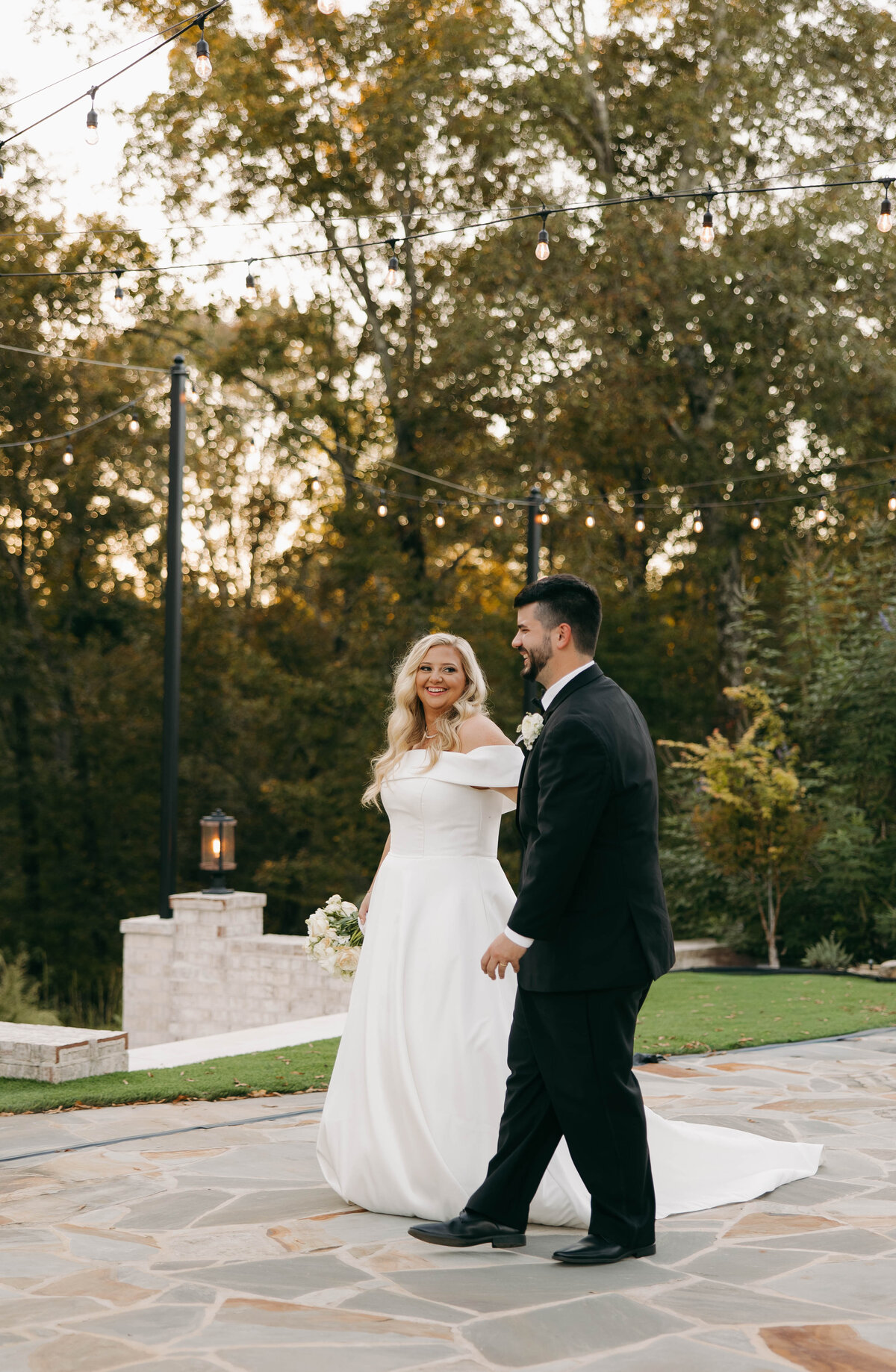 bride and groom walking portrait at danclay farms