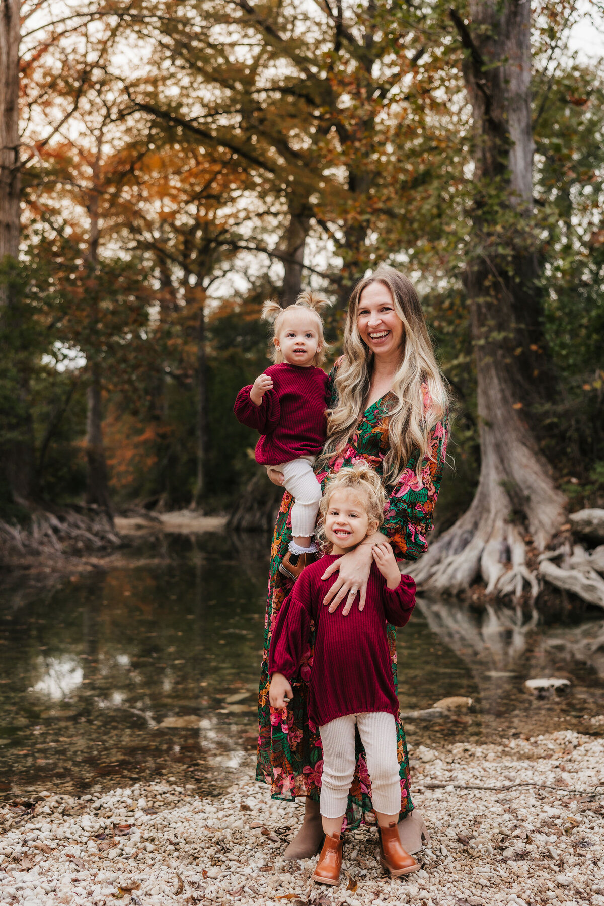 mom-smiles-with-two-daughters
