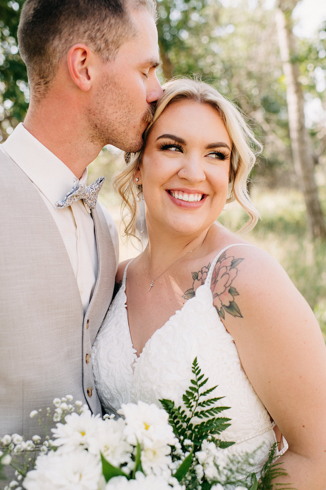 Bride and groom embracing, captured by Kristin Sarah Photography. Featured on the Bronte Bride Vendor Guide.