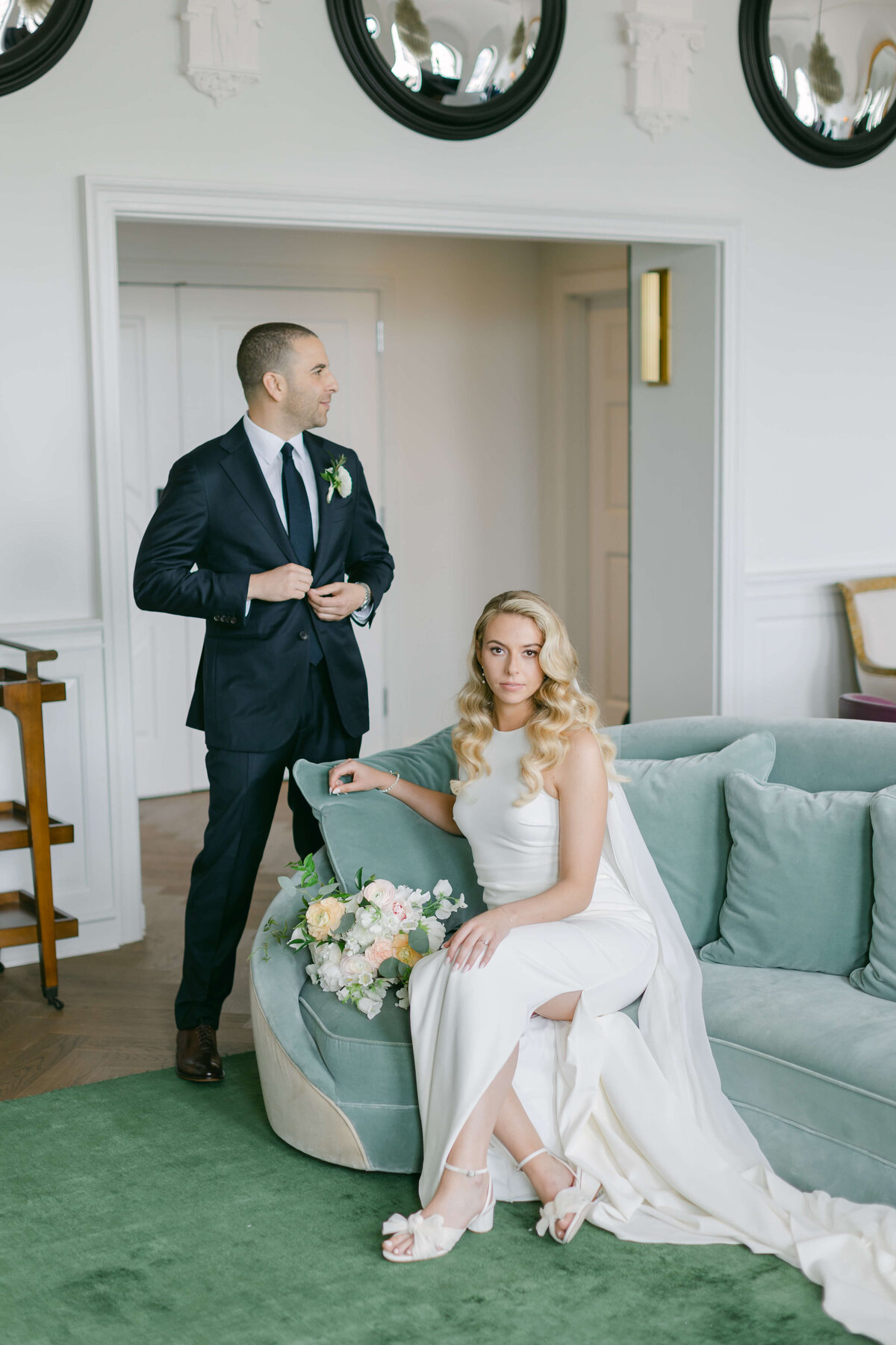 A bride and groom sit in the presidential suite at the Riggs Hotel.