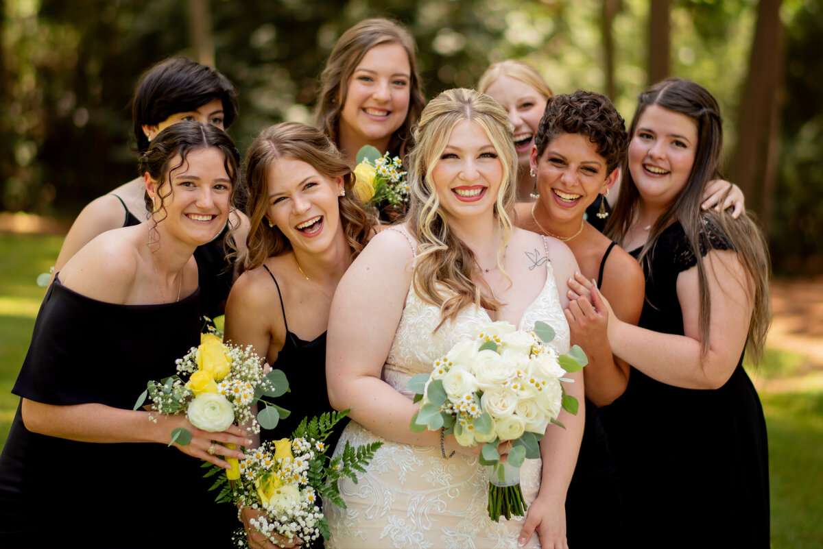 Discover the epitome of elegance as the bride and her bridesmaids come together in perfect harmony at The Springs Event Venue in Magnolia, Texas, celebrating a bond of friendship and love.