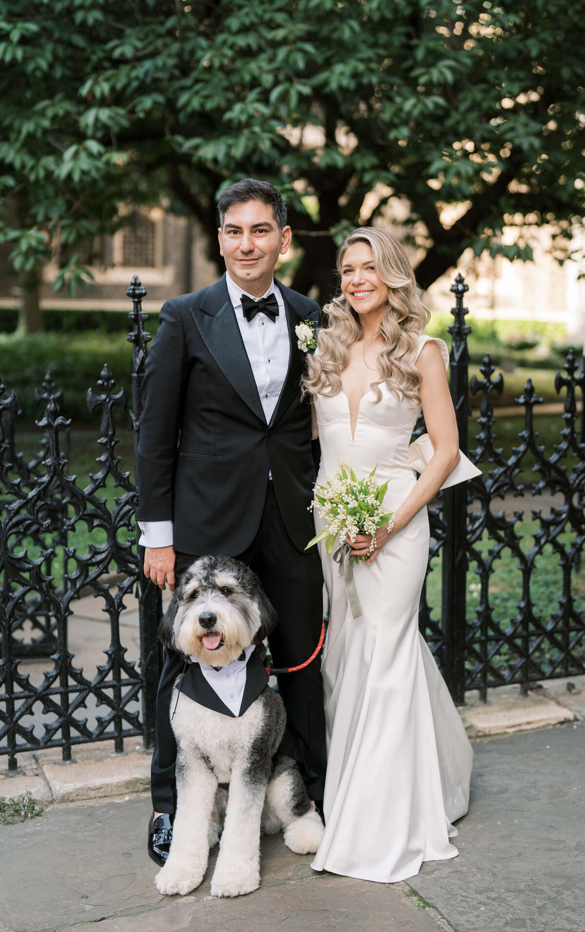 Bride and groom with their dog, for a portrait