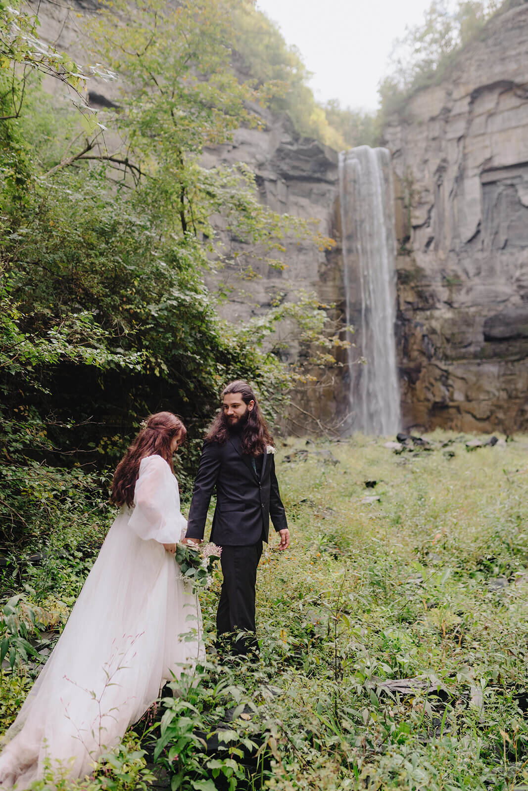 bride and groom in front of waterfall at Finger Lakes wedding, NY