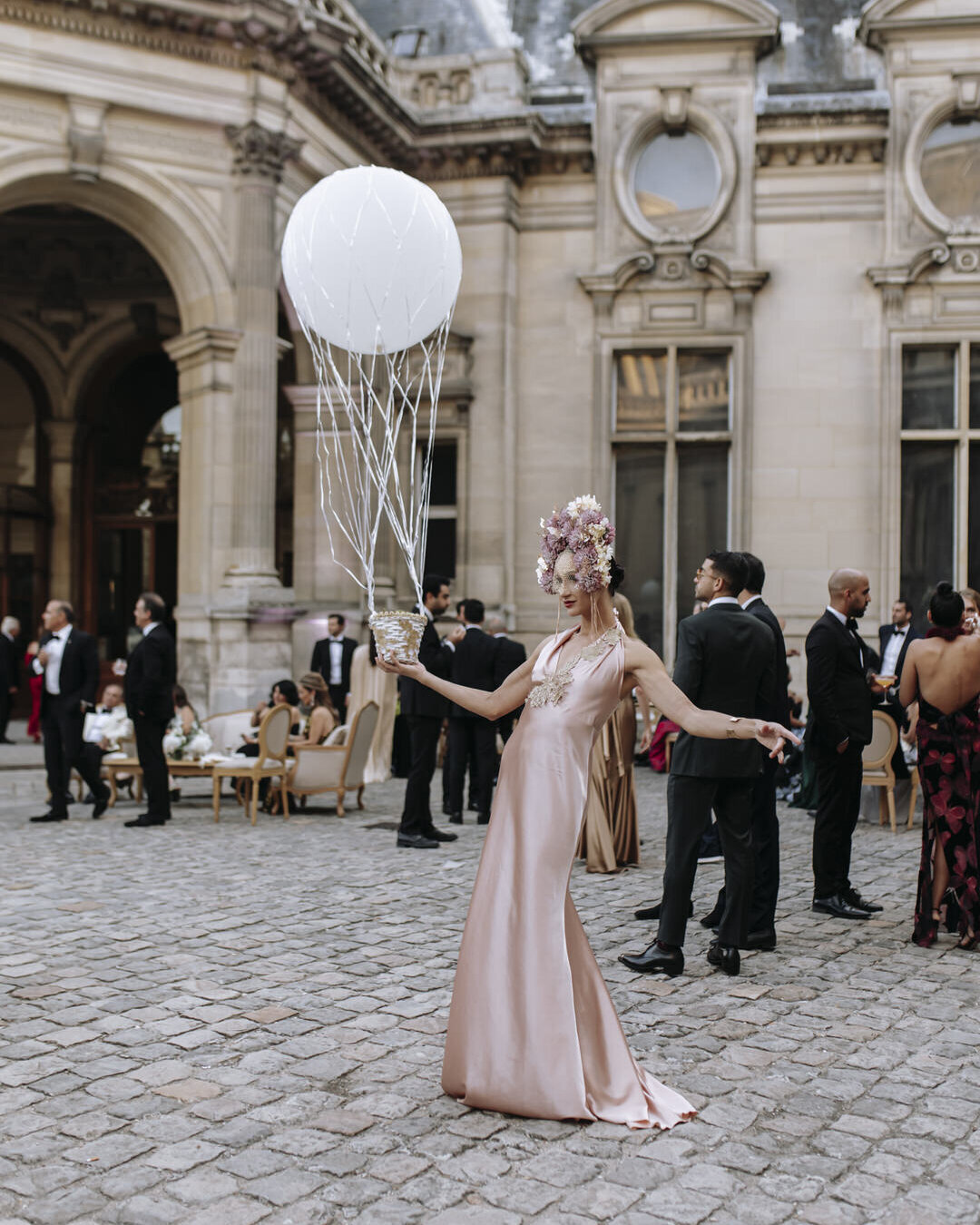 Paris Destination Wedding at Chateau de Chantilly by Alejandra Poupel Events artist pink dress white balloon