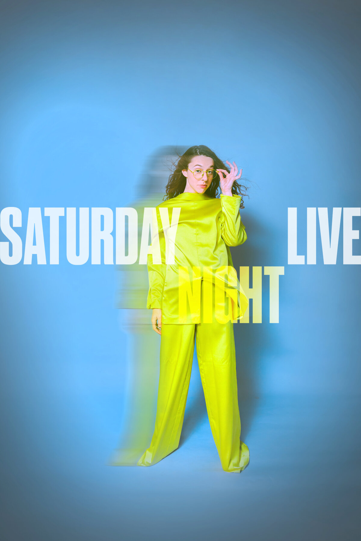 A bold, Saturday Night Live-inspired studio portrait with a woman in a neon green outfit against a bright blue backdrop. Motion blur adds a retro, punchy flair. Shot by Dani Lacey in Greenville SC