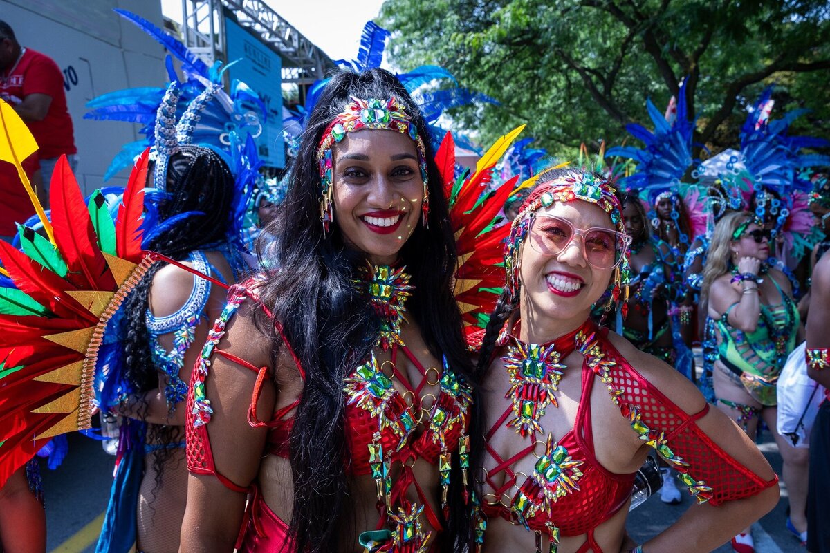 Toronto caribbean carnival parade masquerader in costume with Sunlime Mas, the number 1 medium size band at Toronto Carnival.