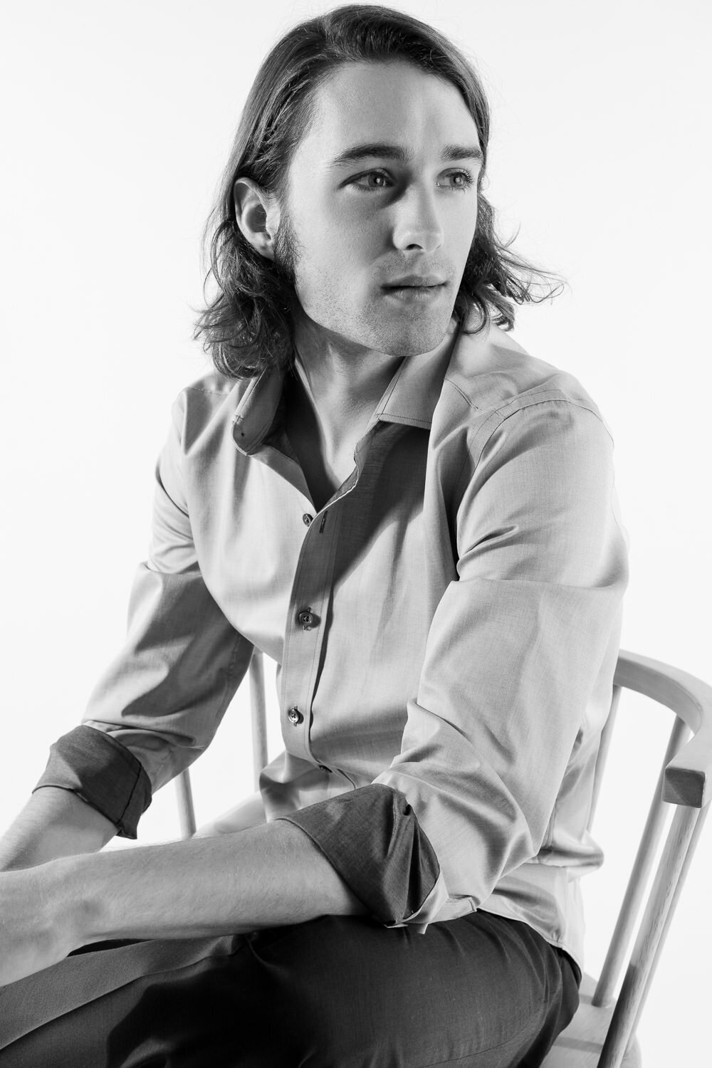 Studio editorial portrait of a professionally dressed man photographed in Austin, TX.