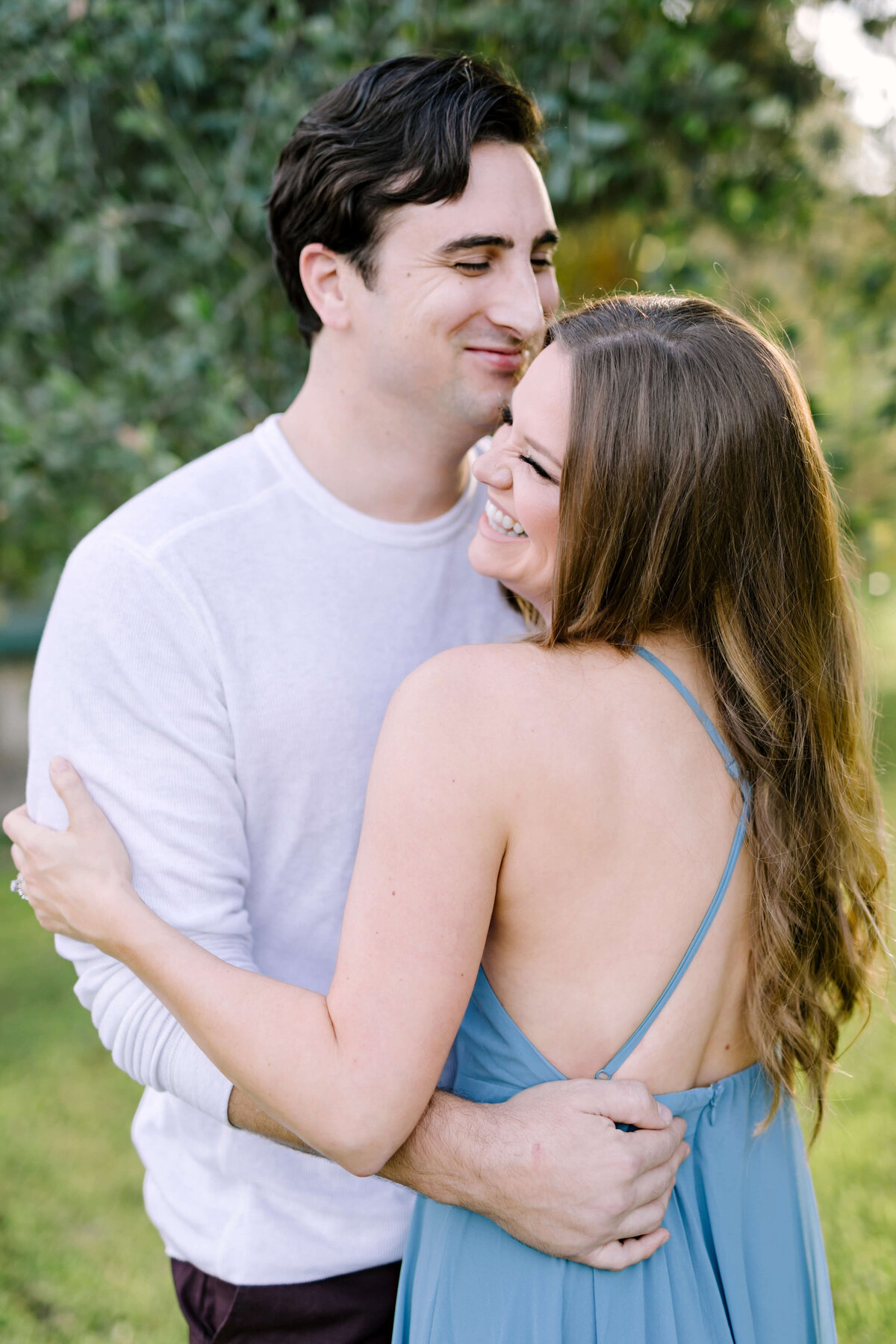 Woman in a dusty blue dress for her anniversary session