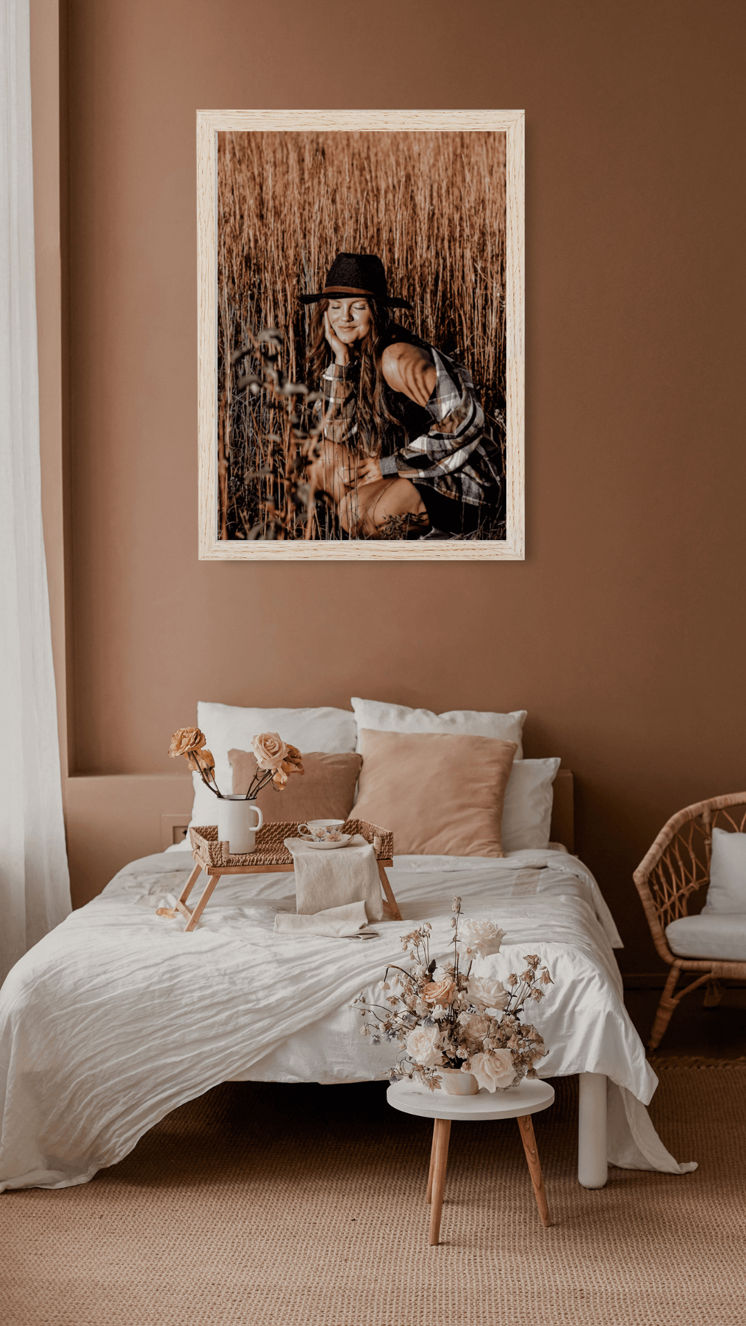 boho bedroom with a framed print of a senior portrait taken in a ootewah,tn  hanging on the wall