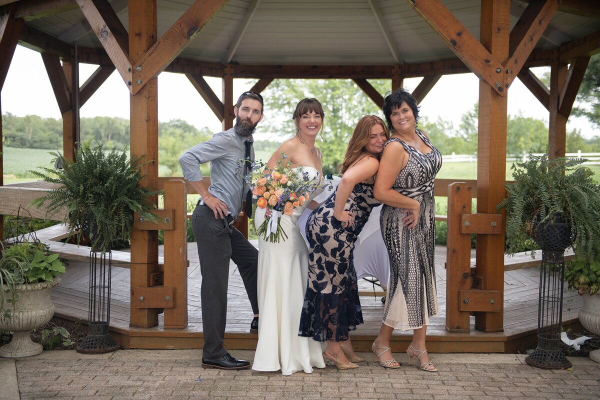 Bride smiling with veil in the wind