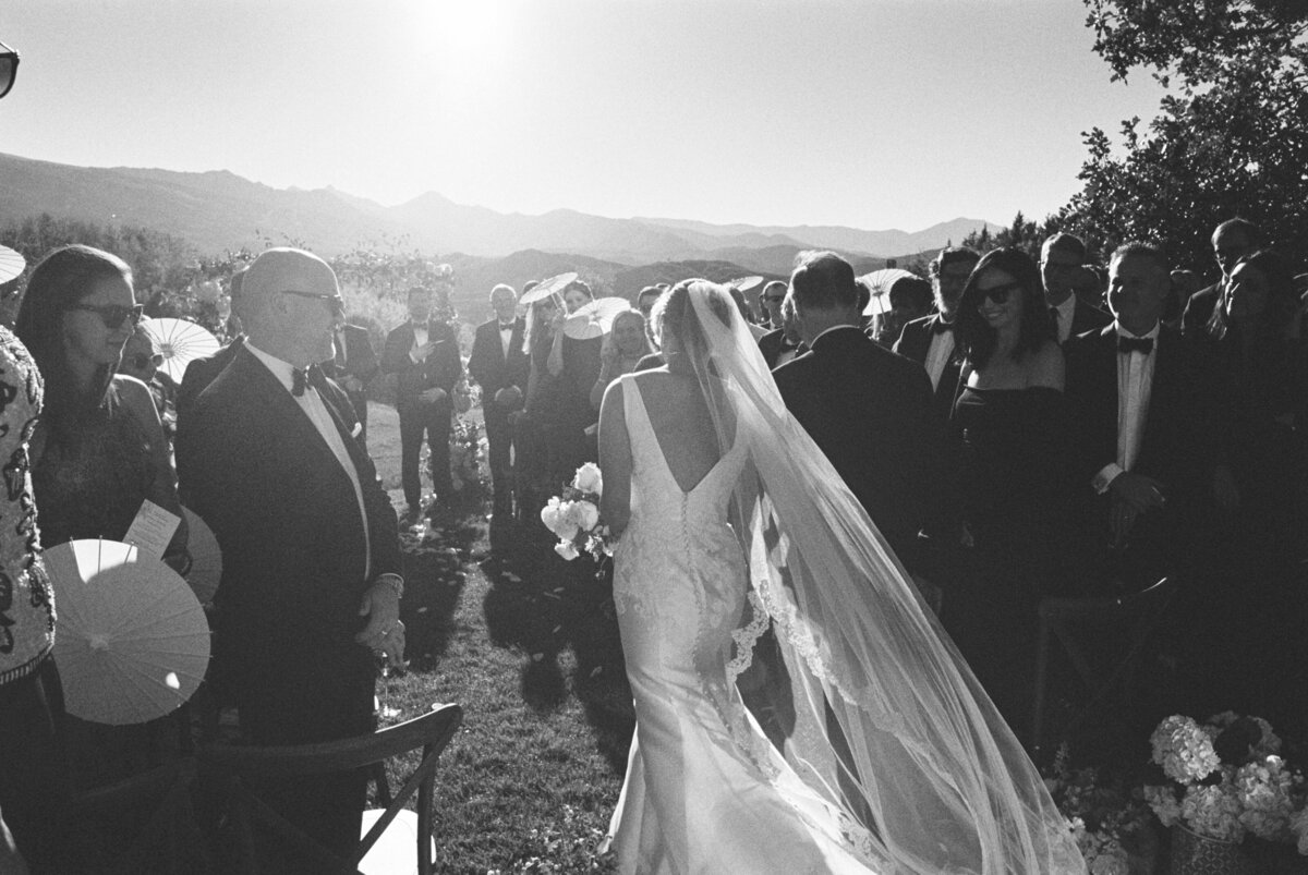 Bride walking down the aisle in Aspen wedding