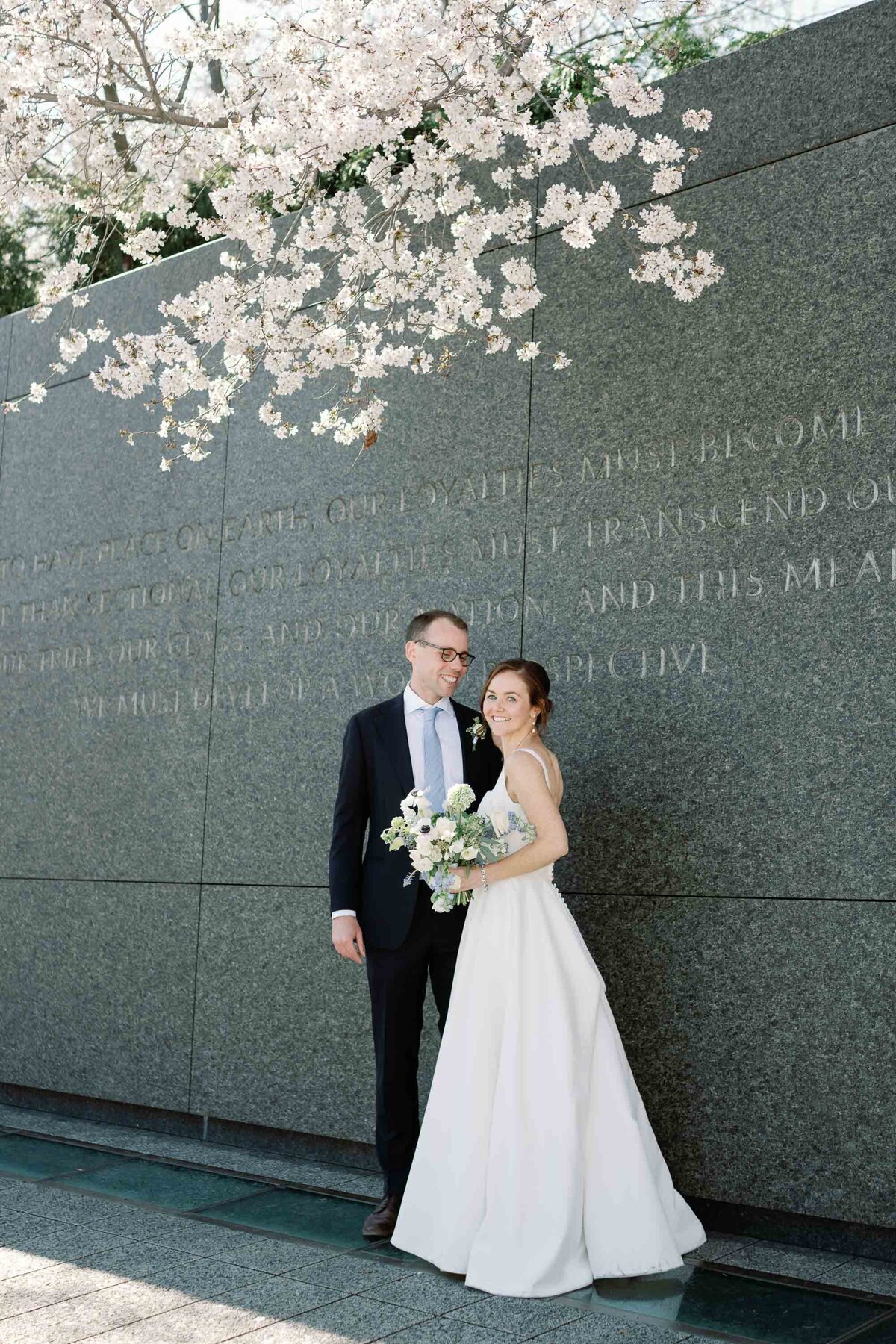 bride and groom at Washington DC MLK monument wedding with cherry blossoms