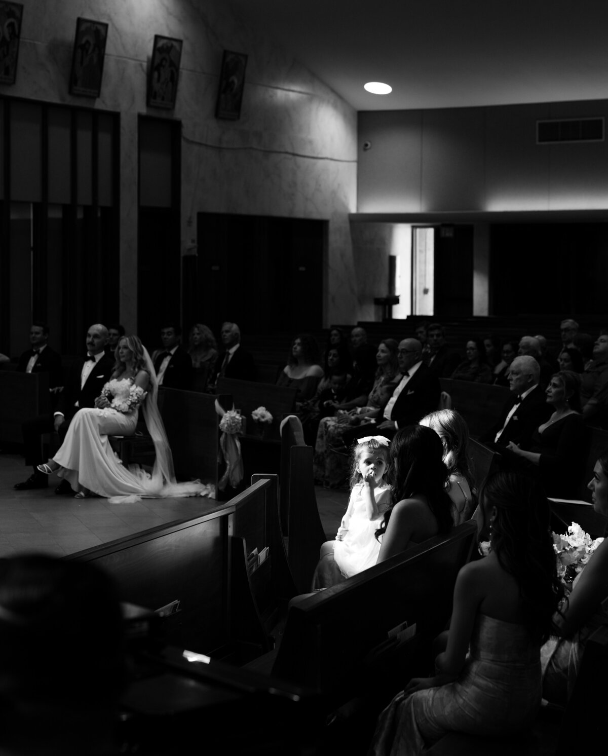 wedding guests watching wedding ceremony in a church