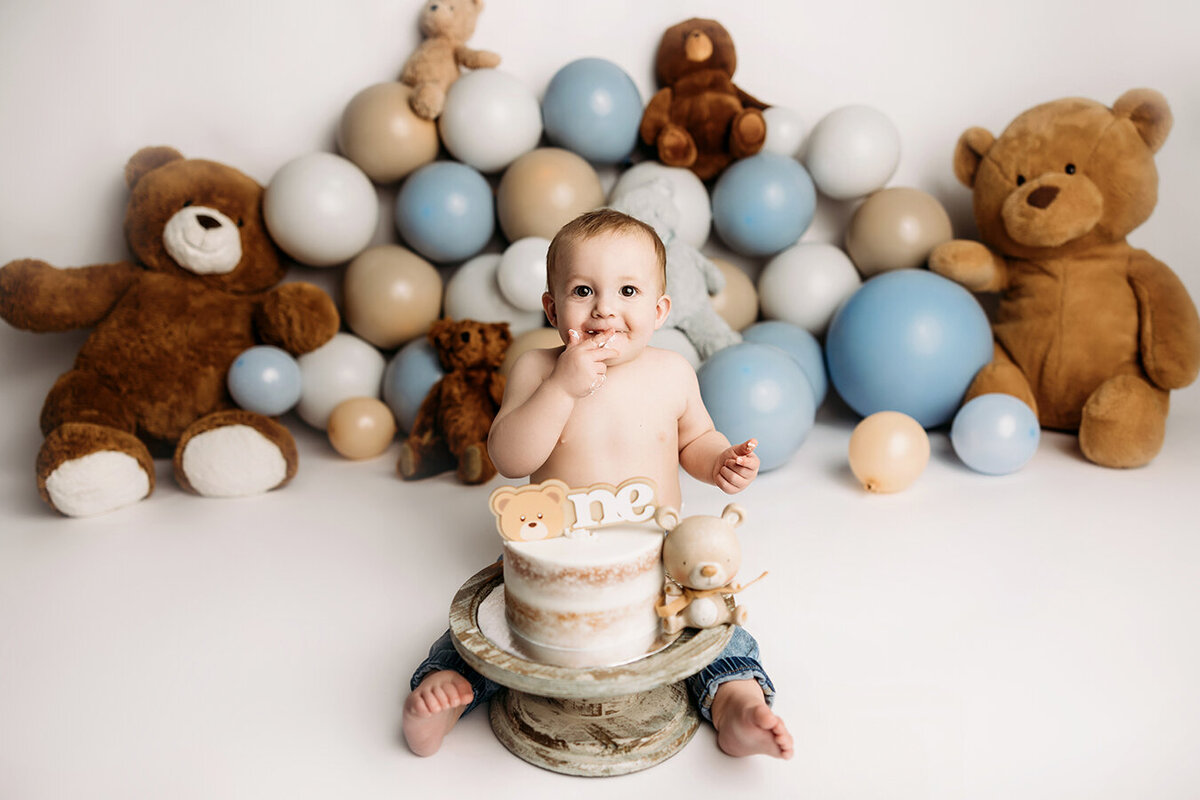 One year old baby boy with teddy bears for his first birthday shoot