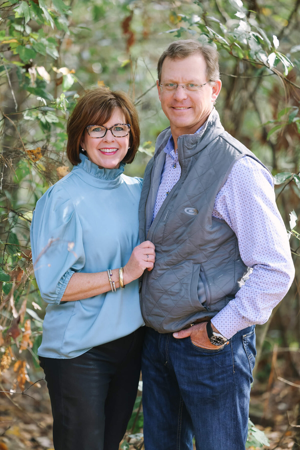 couple-posing-infront-of-trees
