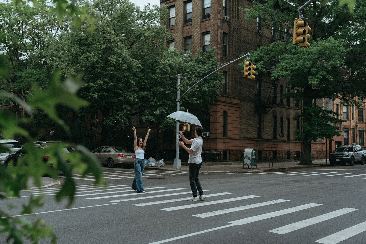 couple posing in street during NYC engagement photoshoot, captured by Elsie Goodman, an NYC engagement and couples photographer