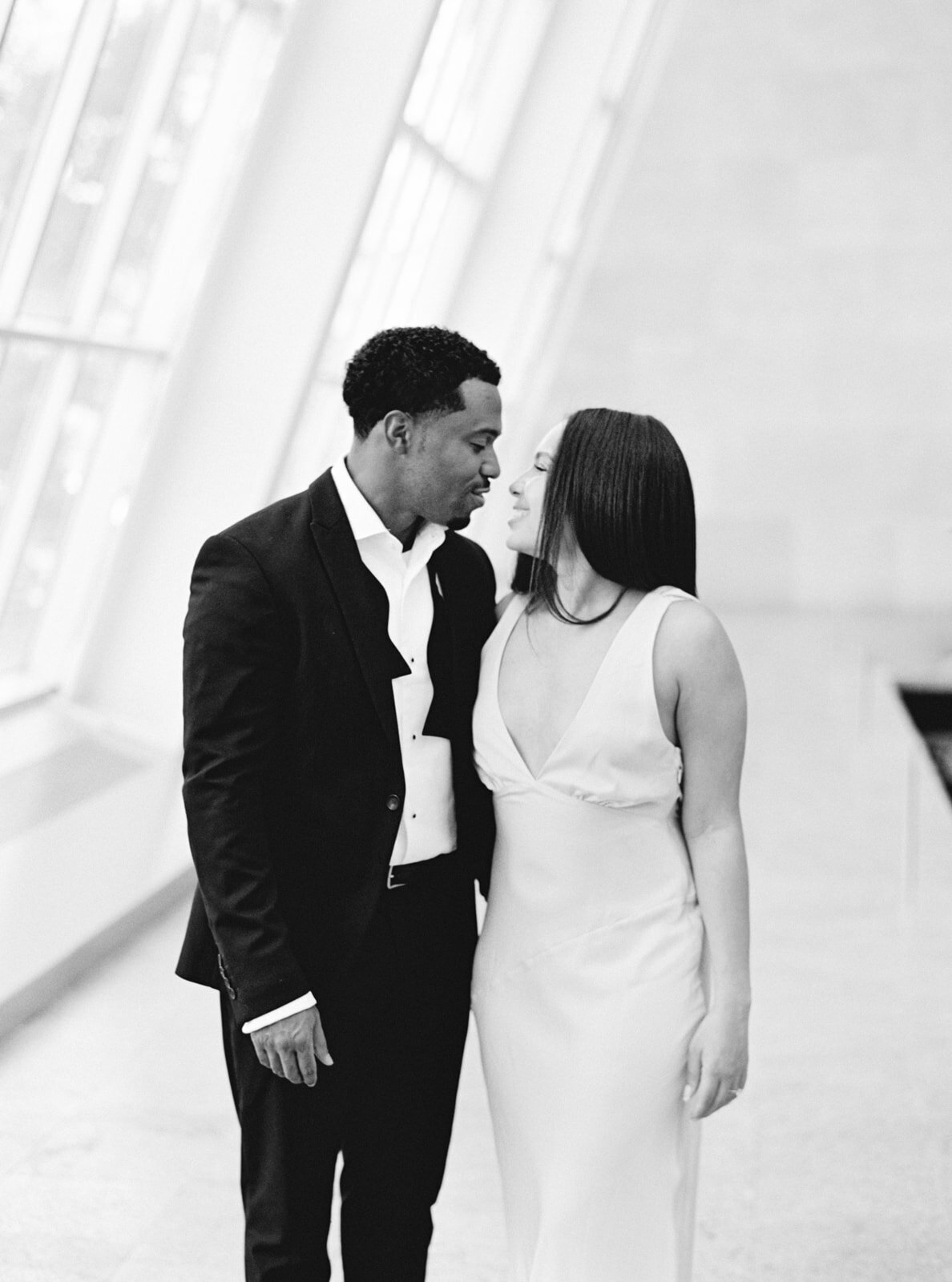 romantic couple session, couple in museum, almost kissing