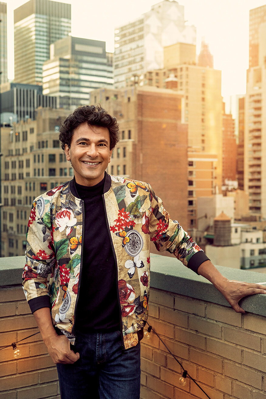 Stylish portrait of chef Vikas Khanna in a colorful jacket, captured outdoors by Ylva Erevall.