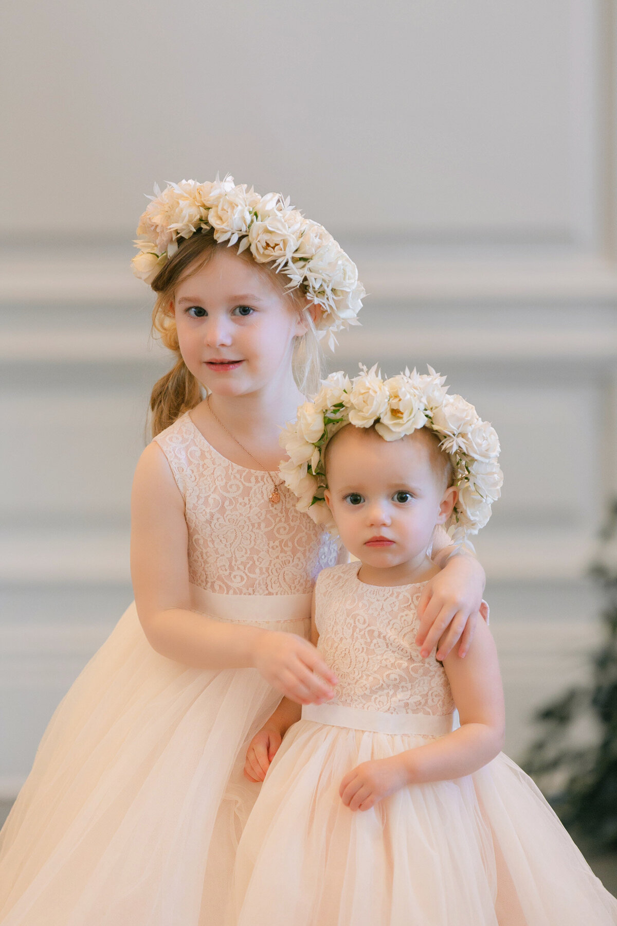 portrait of the flower girls at The Adolphus in Dallas, capturing their charming presence and elegant dresses during the wedding day.
