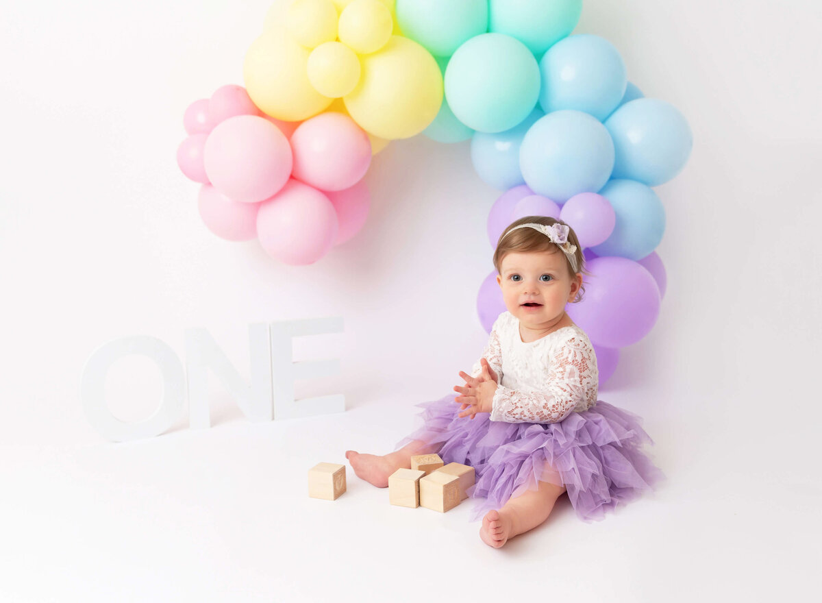 Raiboy theme cake smash for girl 1st birthday session in NYC