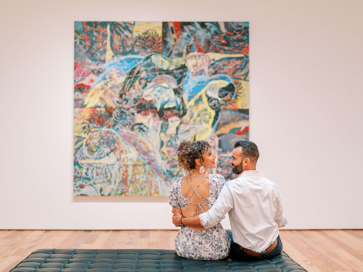 Couple sitting in a museum