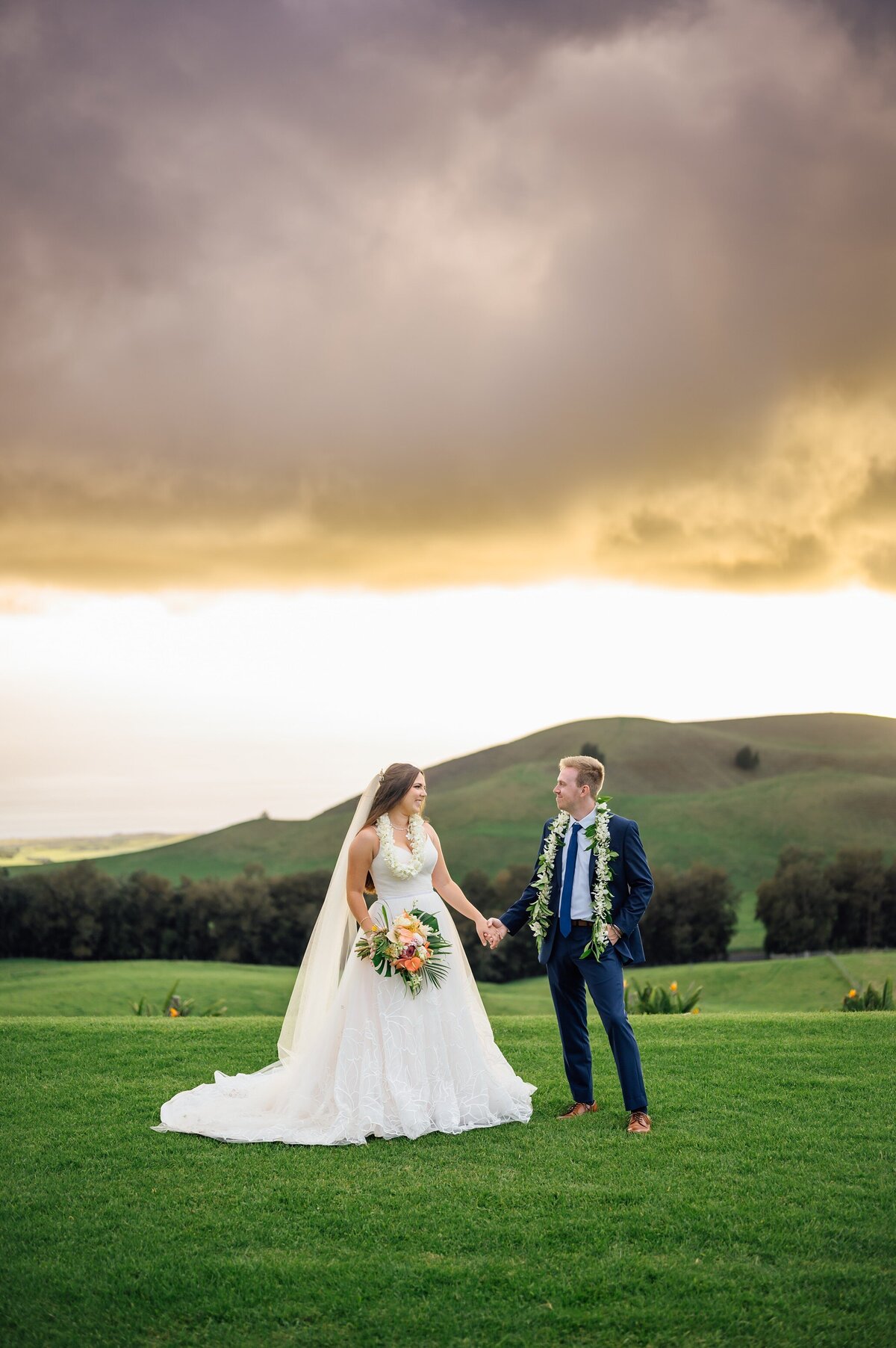 bride and groom holding hands