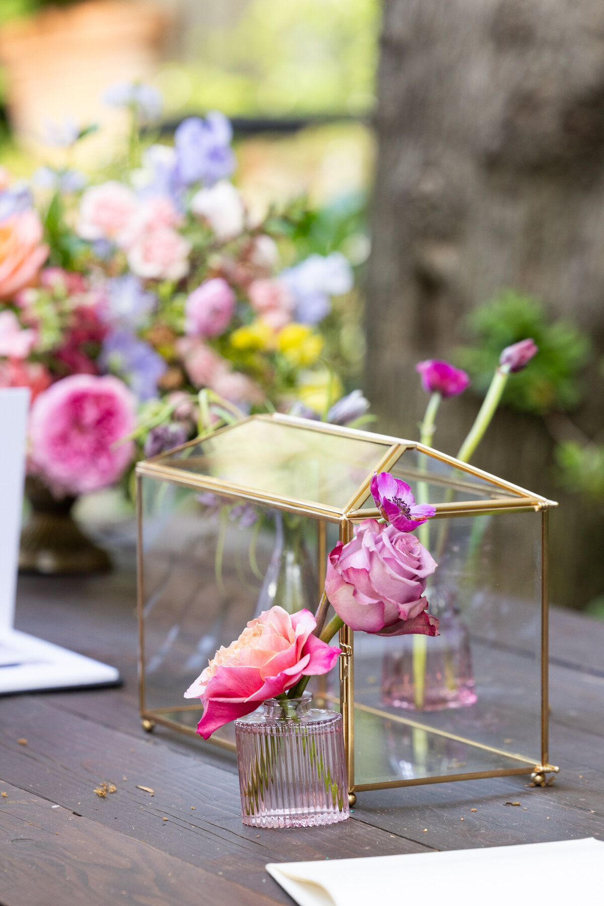 Small flowers in a glass cup on a table