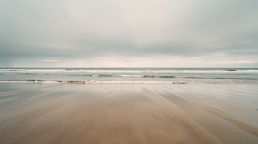 beach long stretch stormy sky