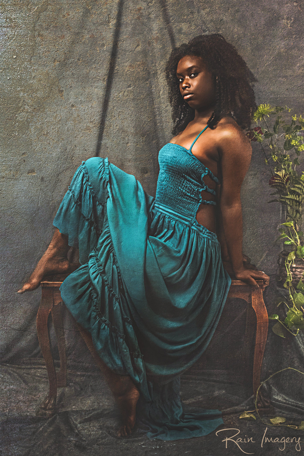 Woman of color in a blue dress, fine art portrait by a photographer in Virginia