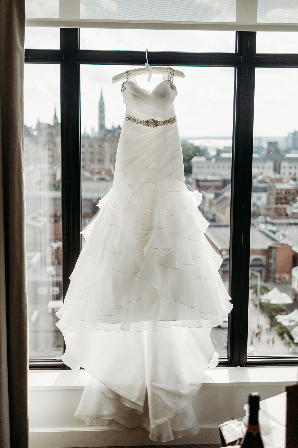 Weddng Dress hanging in the window at Andaz Hotel in Ottawa