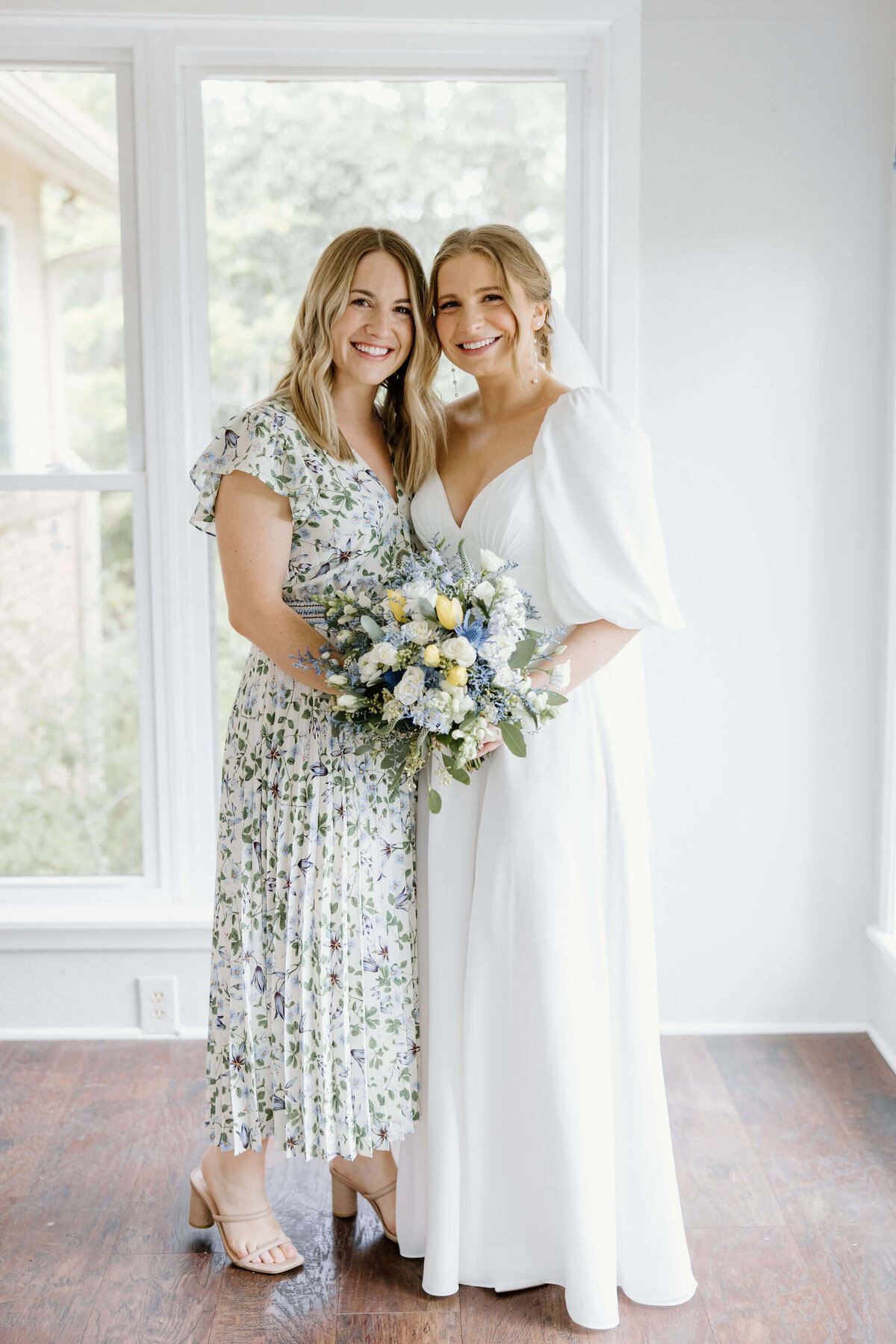 bride with sister before wedding day ceremony