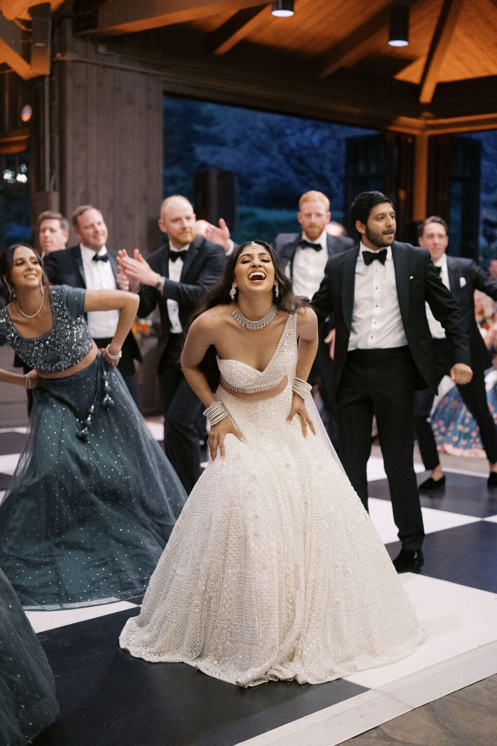 Bride and wedding party performing a choreographed Bollywood dance during the reception at Old Edwards Inn in Highlands, NC.
