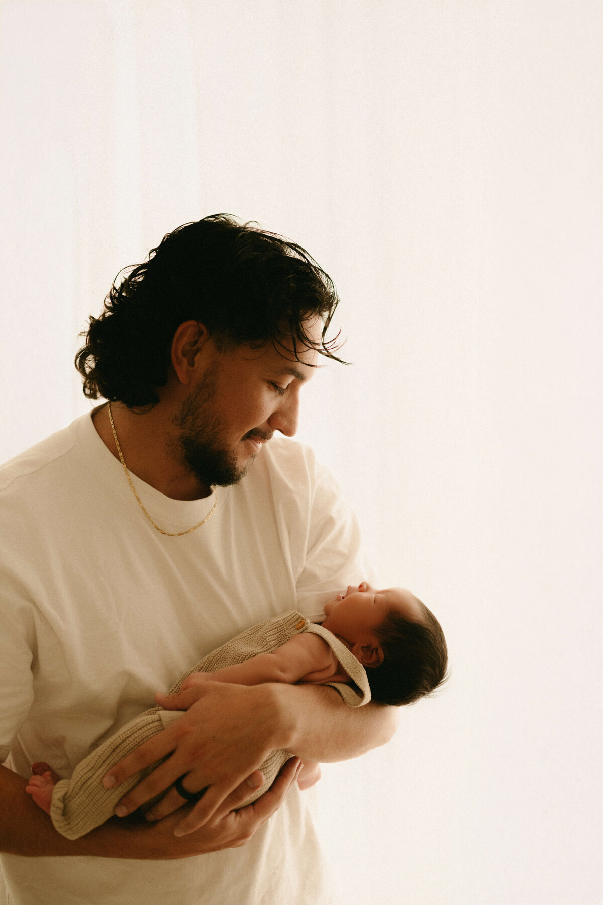 Minimalist baby photo wrapped in soft knit during Nashville newborn session 
