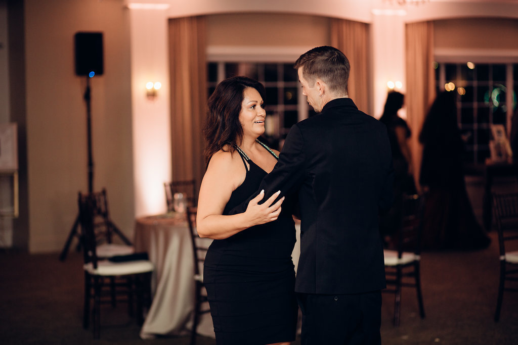 Wedding Photograph Of Of Groom Dancing With a Woman In Black Dress Los Angeles