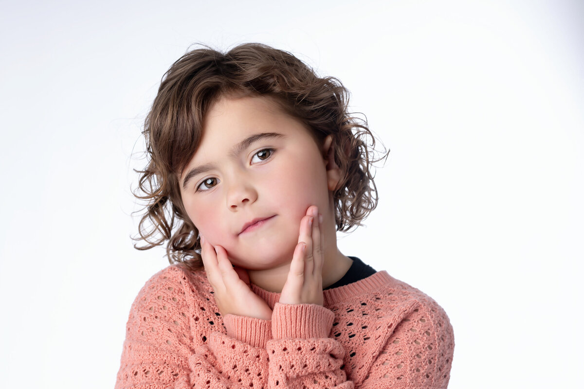 Little girl looks dramatic on white in her Iowa Milestone Photos