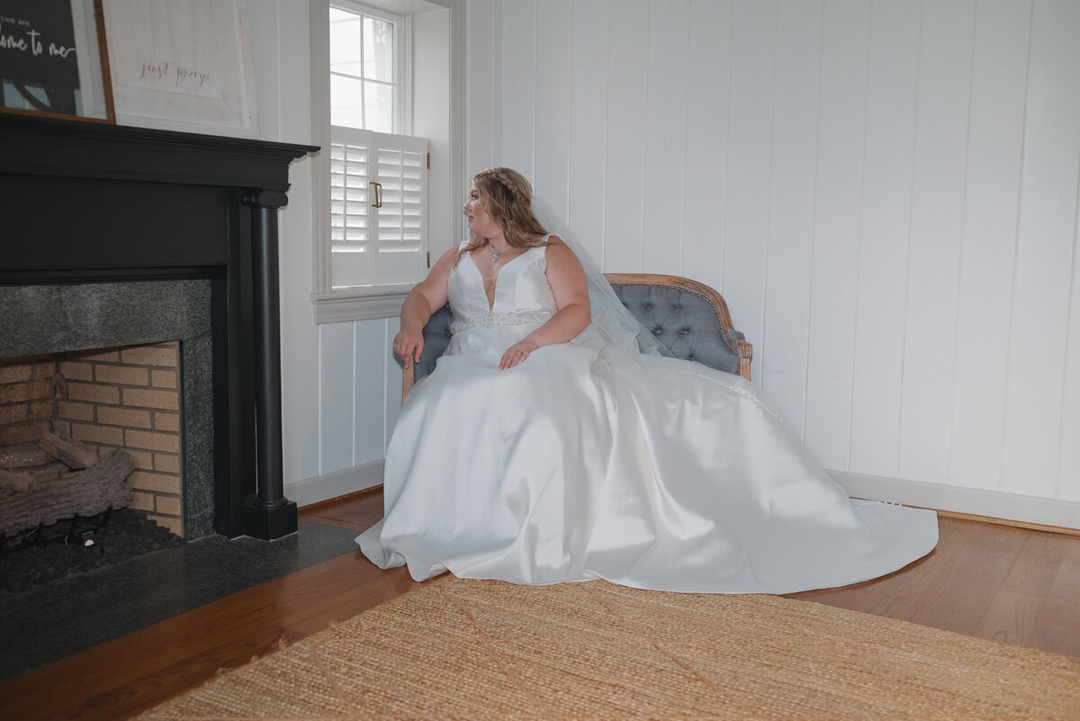 Bride looking out windows 
