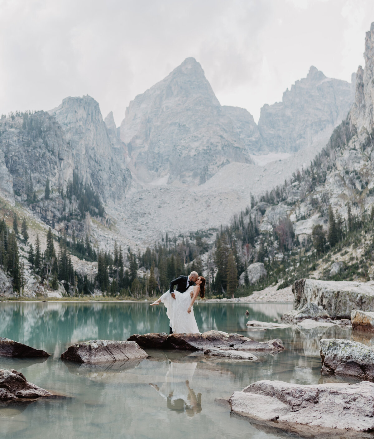 Jackson Hole Photographers capture groom dipping bride