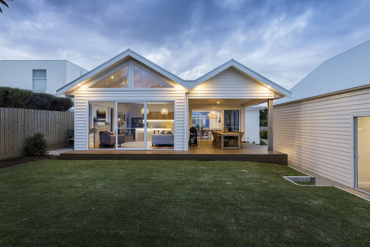 Pitched roof white weatherboard home extension