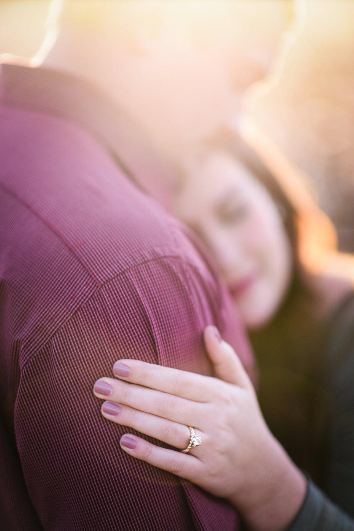 Beautiful Mississippi Engagement Photography: bride to be shows off ring during sunset cotton field session in Mississippi