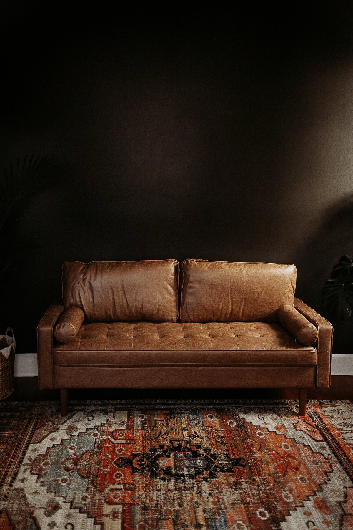 Dark wall with leather sofa