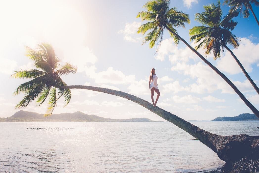 Woman in Bora Bora on a palmtree
