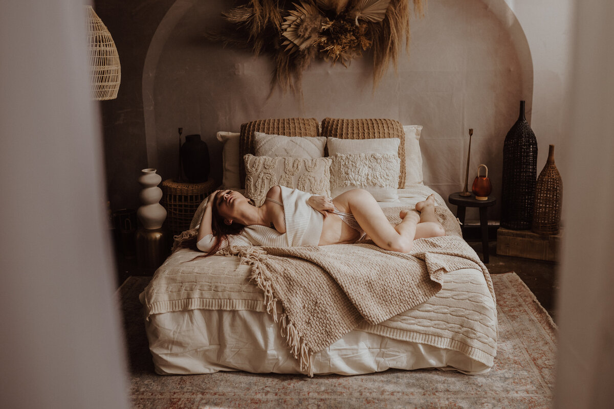 playful-boudoir-sweater-pose-lingerie-storyteller-studio-des-moines-storyteller-collective-photo-co
