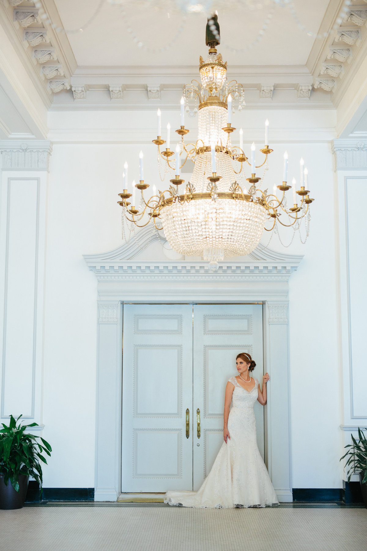 bride in front of door inside the St. Anthony hotel, a Luxury Collection Hotel in San Antonio
