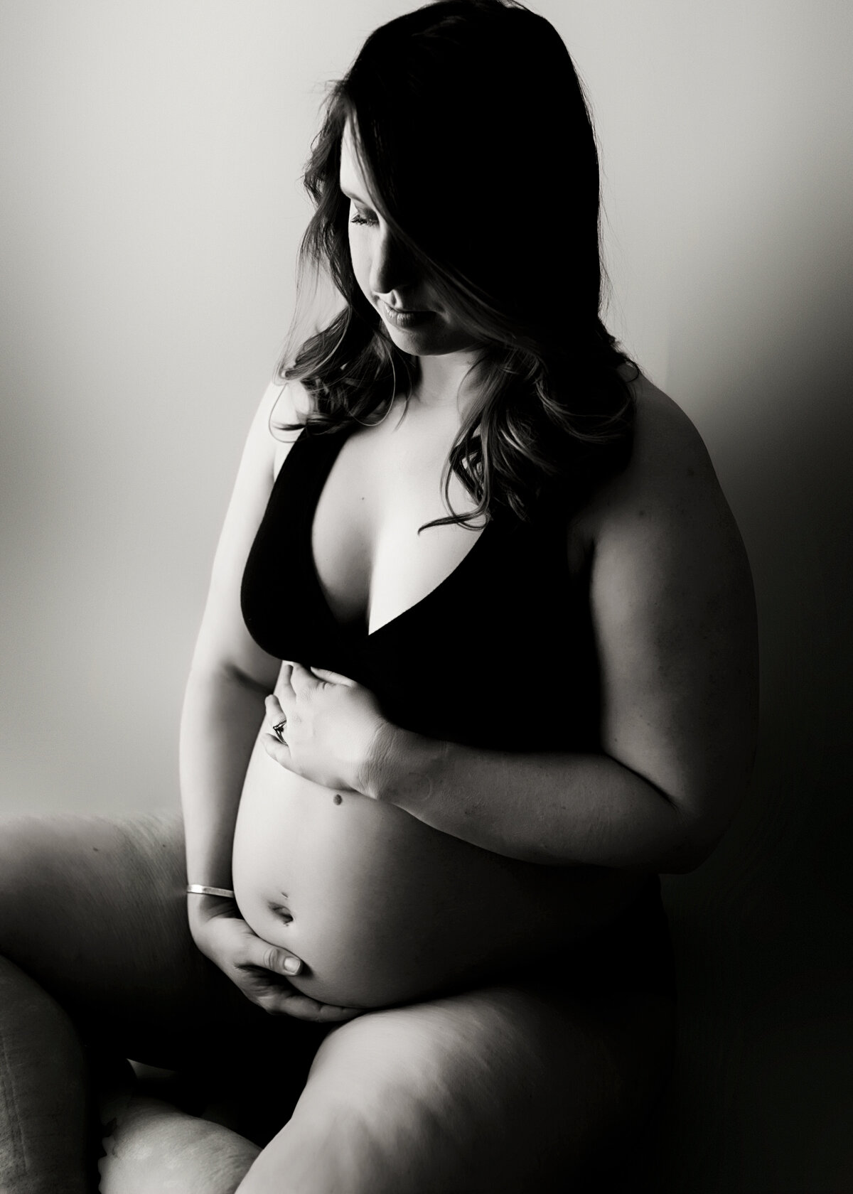 Lovely black and white pregnancy portrait in a photography studio in Arvada Colorado