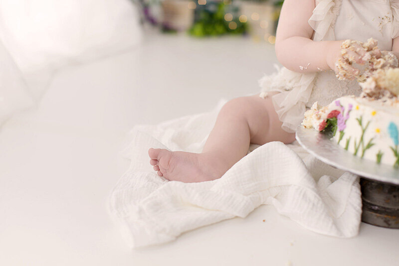 A smashed cake during a first birthday photo session