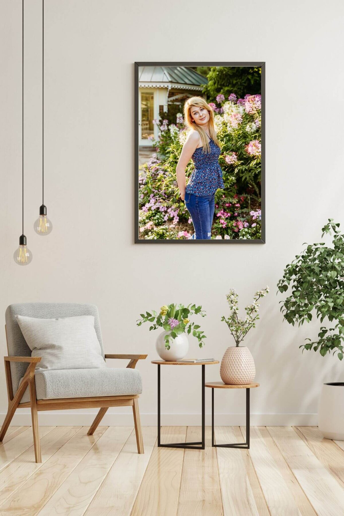 gorgeous framed print of a teenage girl hanging on a white wall in a sitting room that has plant accents
